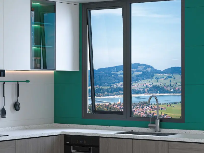 Aluminium casement window tilted open in a kitchen setting