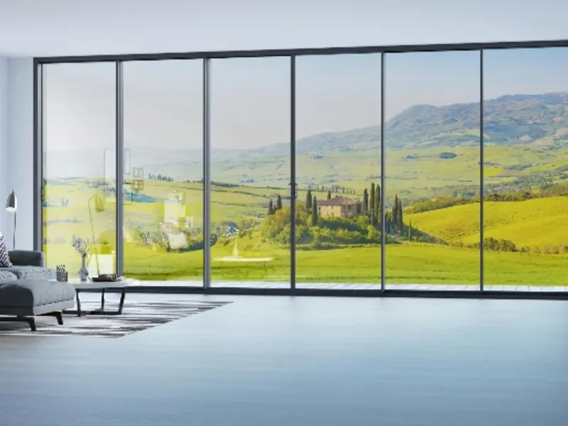 Slim aluminium sliding door system opening onto a landscape view