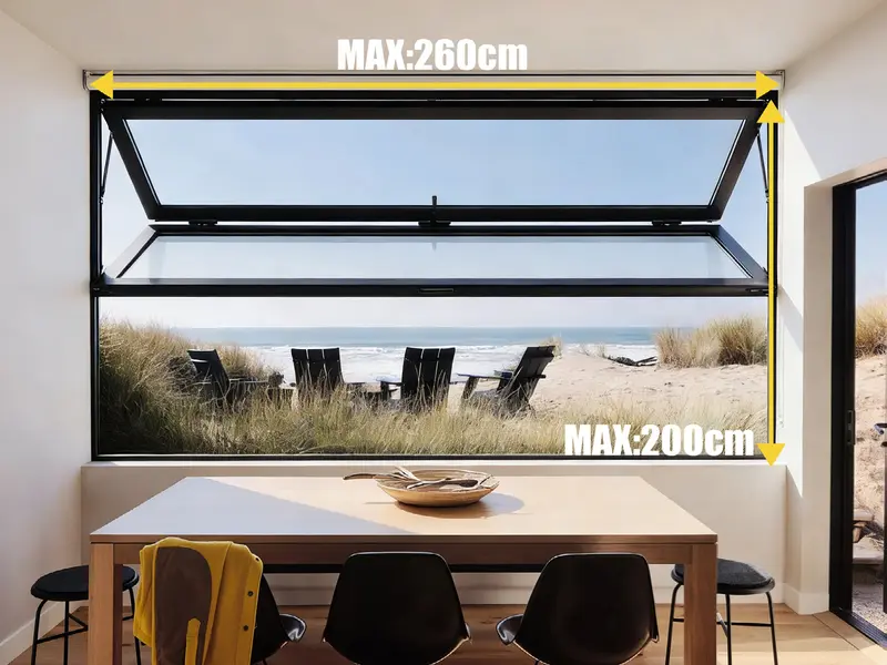 Black-framed aluminium top-hinged folding window open above a dune-grass ocean view